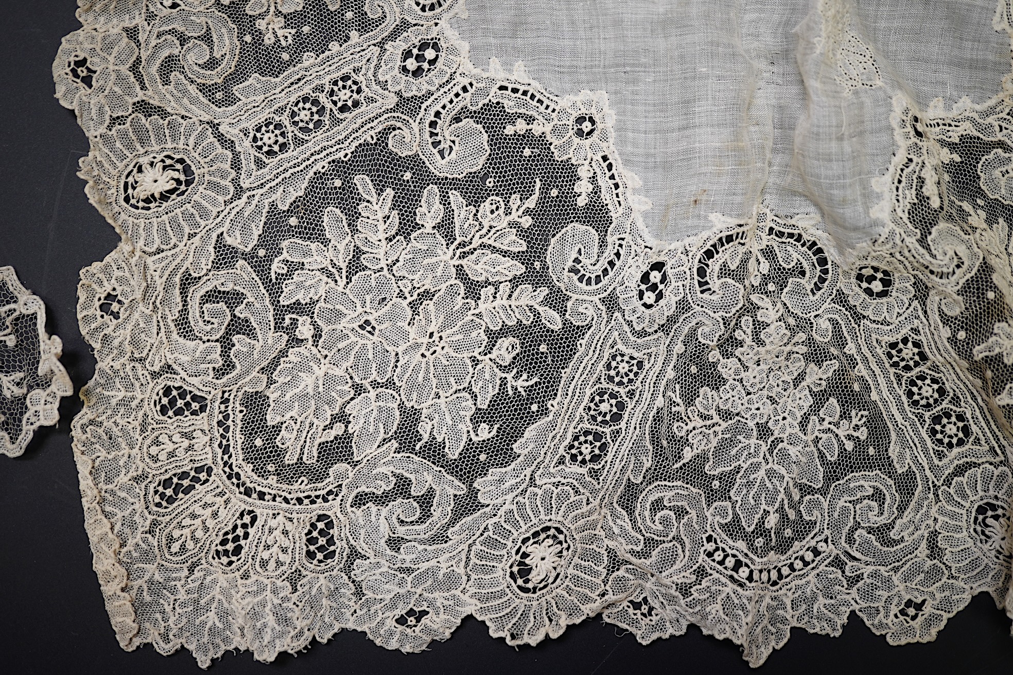 A 19th century Brussels Point de Gaz needle lace collar, lappet and wedding hankie, possibly part of a trousseau. The collar having thirty four needle lace raised flower heads within the design. The collar 100cm long x 1